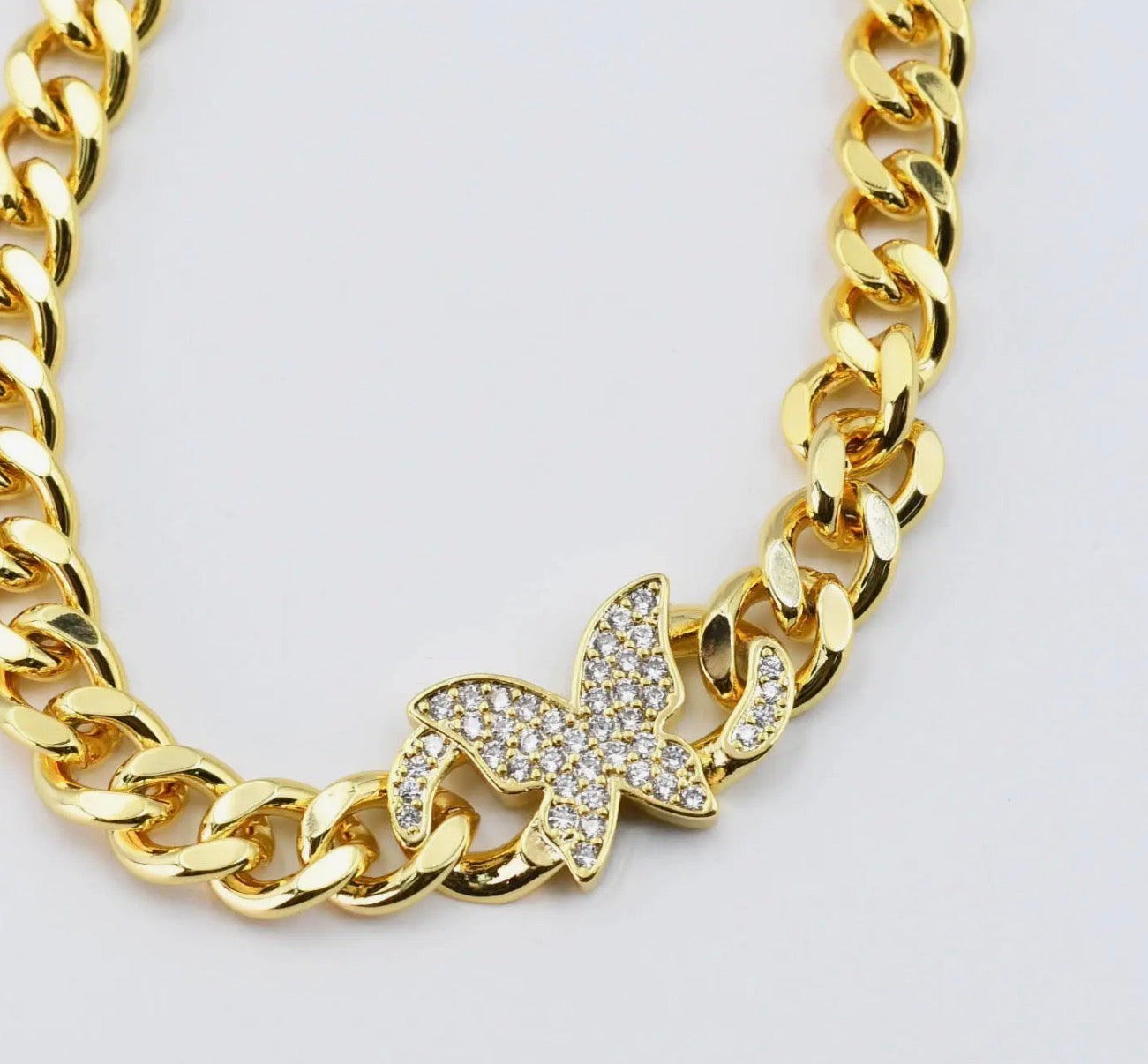Gold butterfly chain necklace from Treasure Jewels with delicate butterfly charms and fine chain design.