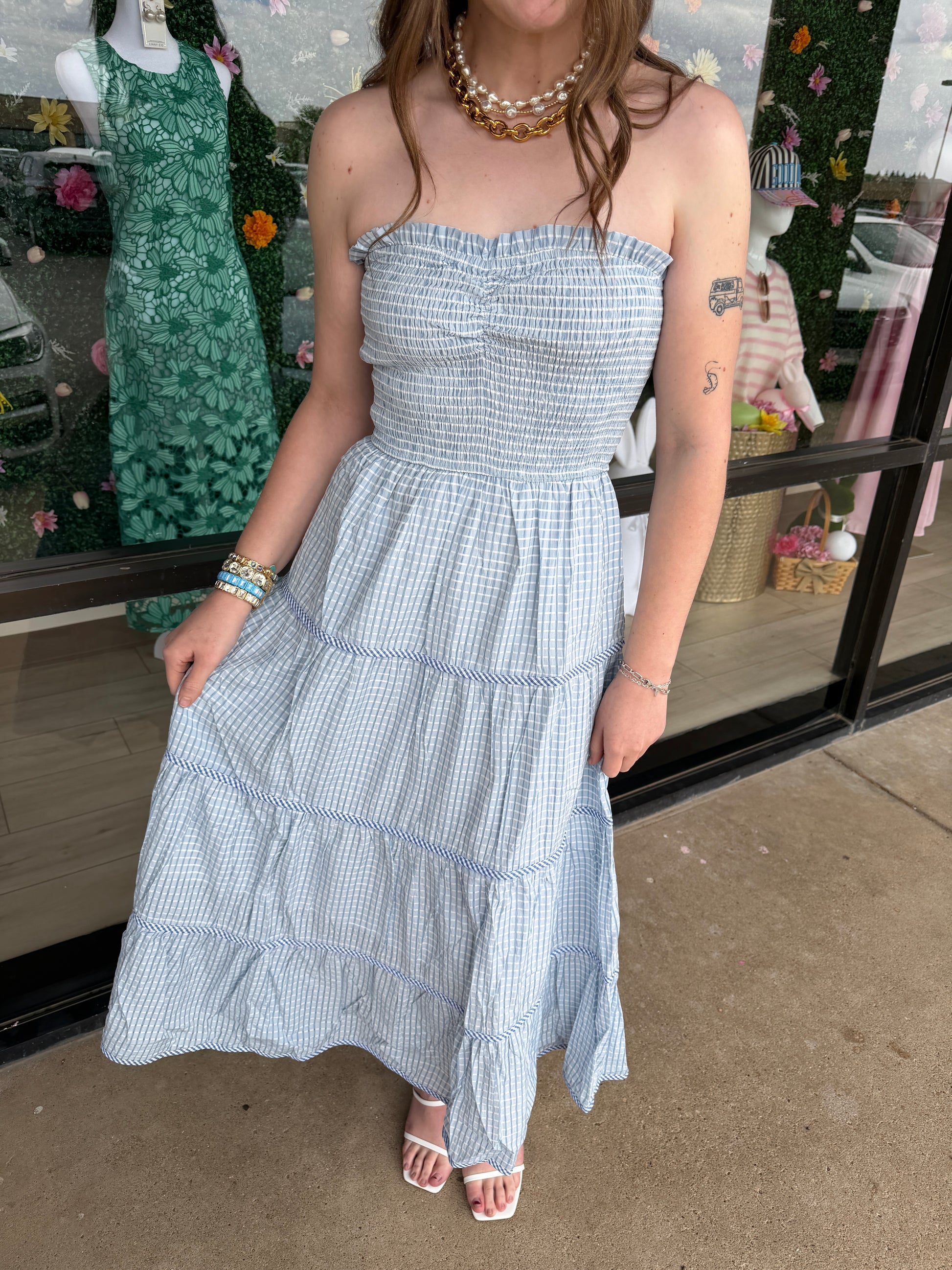Baby Pink Soft Statement Midi Dress in baby blue, showcasing a flowing, elegant design with a fitted waist and stylish neckline.