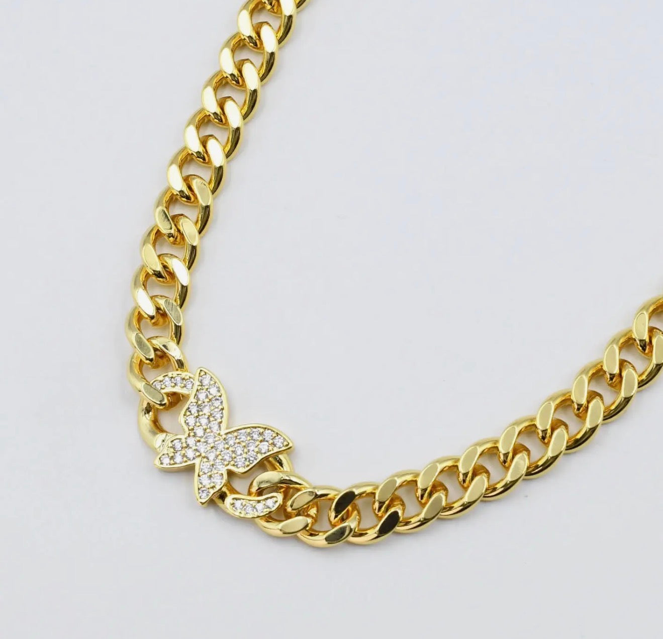 Treasure Jewels butterfly chain necklace featuring delicate gold links and a butterfly pendant.