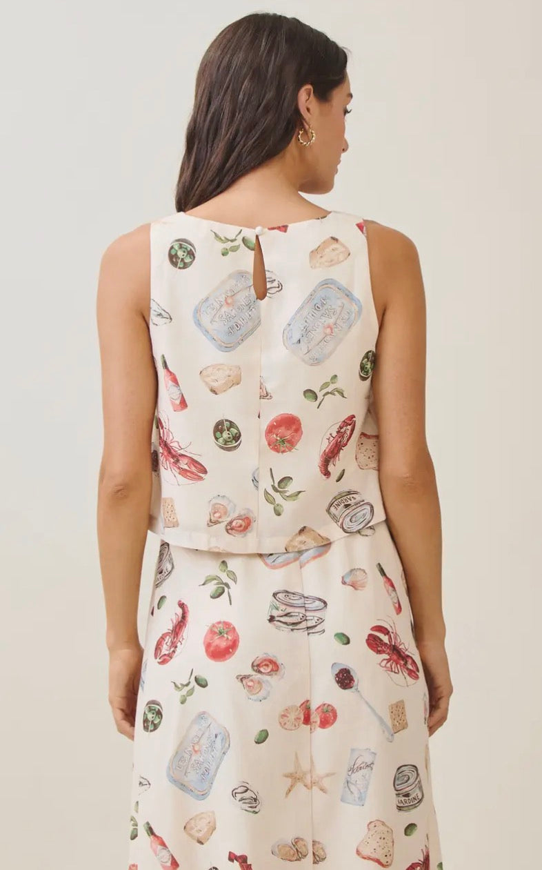 Able Seaside Pantry Tank Top displayed on a hanger, featuring a light fabric and casual fit perfect for summer wear.