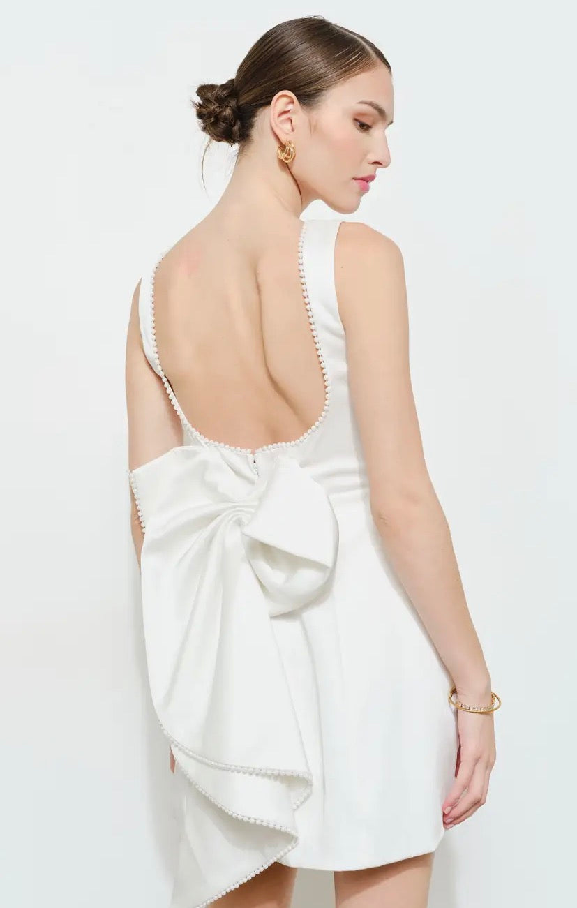 Full-length image of INA's The Dream Dress showcasing its elegant design and flowing fabric on a neutral background.