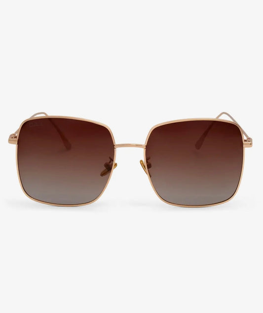 Full view of Dax Eyewear Saint brown eyeglasses with rounded frames and metal accents, showcasing stylish eyewear design.