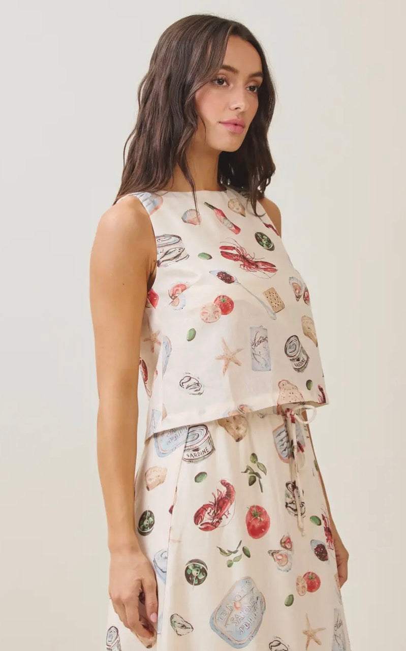 Able Seaside Pantry tank top displayed on a model, featuring a casual fit and seaside-inspired design.