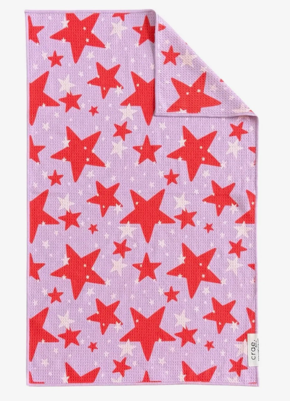 Set of two 17x27-inch beige hand towels from crae.home with soft, absorbent cotton fabric, neatly folded.
