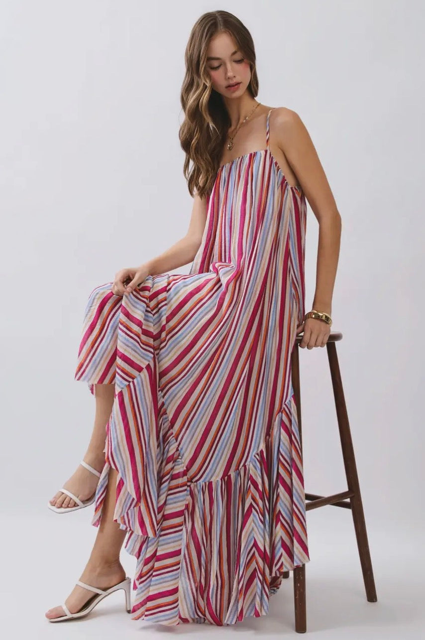 TCEC Summer Skies Maxi Dress featuring a flowing fabric, vibrant sky-inspired print, and sleeveless design, perfect for warm weather.