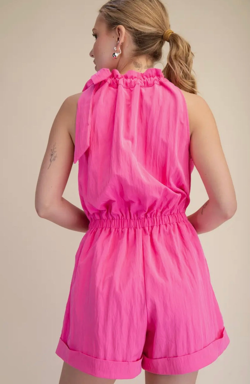 Pink Sugar Rush romper by GLAM, full-body shot showing the stylish pink jumpsuit with a fitted waist and playful design.