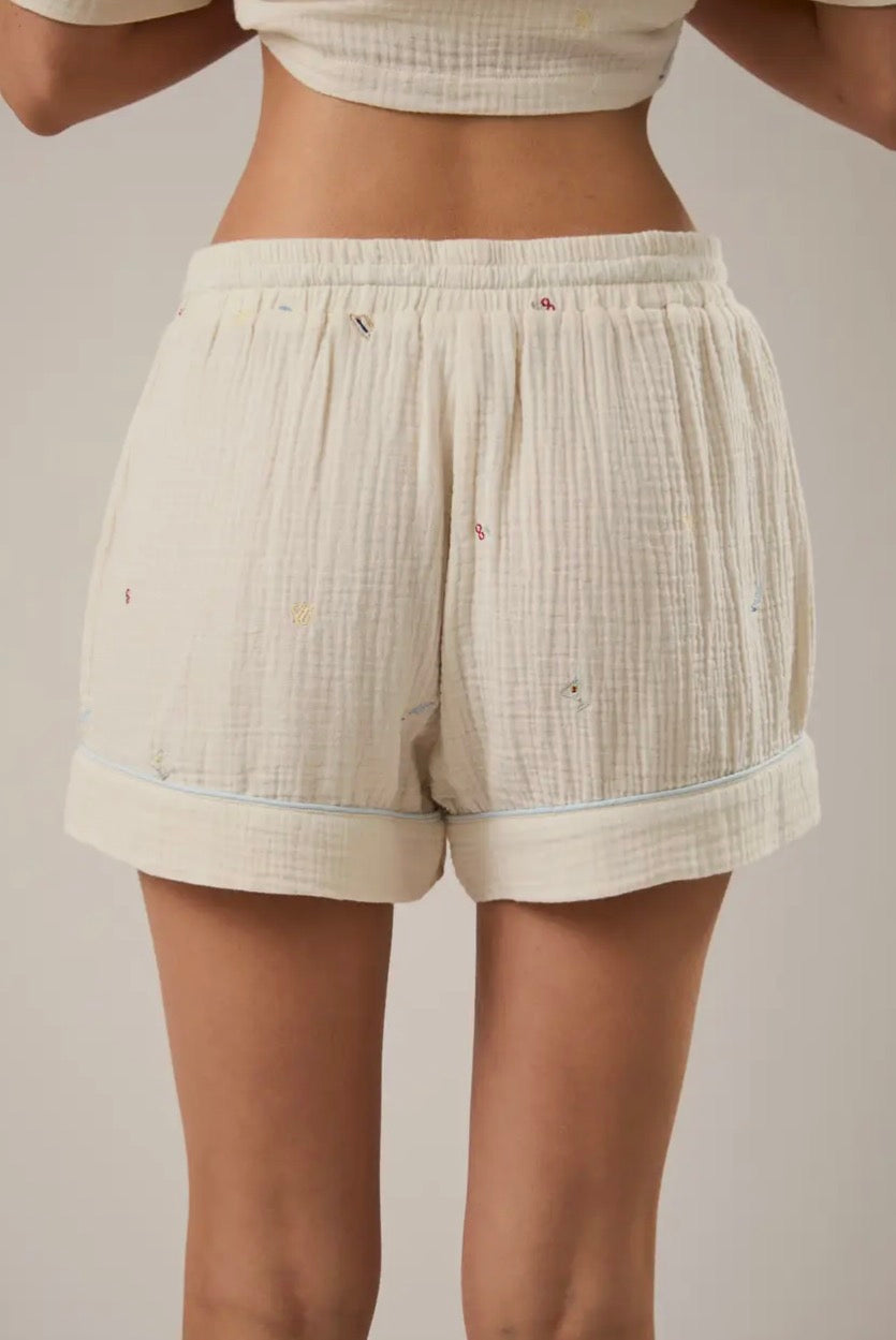 LE LIS The Vacation Edit shorts in lightweight fabric, shown in a relaxed fit with a tie waist and casual style.