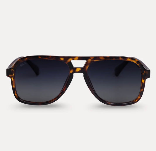 Dax Eyewear Cruz tortoise sunglasses with full frames and stylish design, shown from a front view.