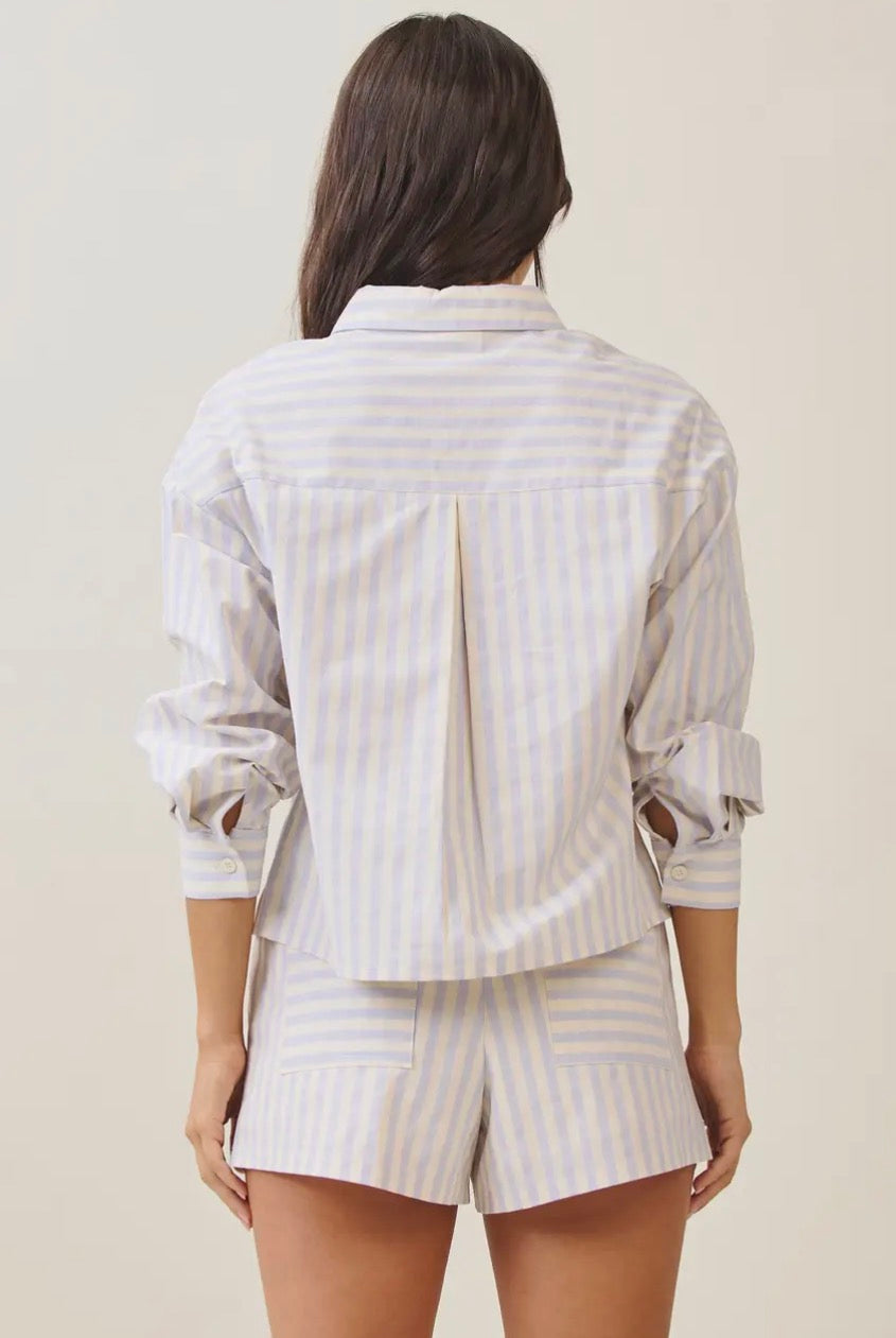 Able Lobster Luxe Linen Top in coral, featuring a relaxed fit with short sleeves and a V-neck design.