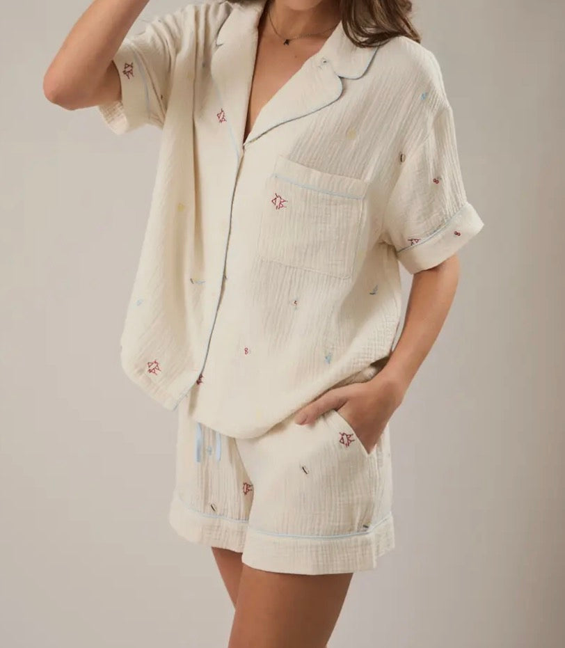 LE LIS The Vacation Edit Top shown on a model, featuring a stylish summer design with lightweight fabric and trendy neckline.
