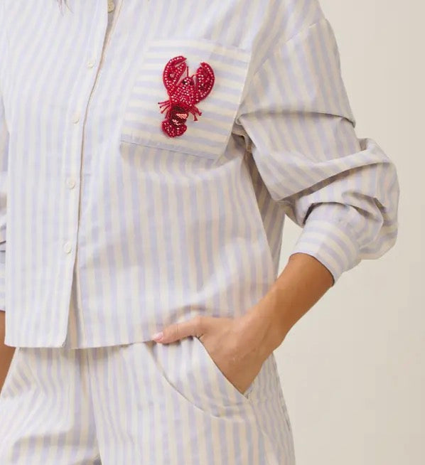 Able Lobster Luxe Linen Top shown on a model, featuring a relaxed fit, lightweight linen fabric, and stylish design details.