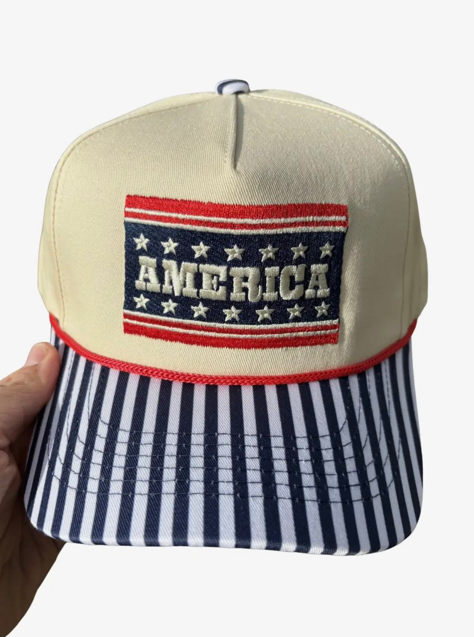 Summer Tees America Hat, casual wide-brim sun hat with patriotic star pattern and adjustable strap, viewed from the front.