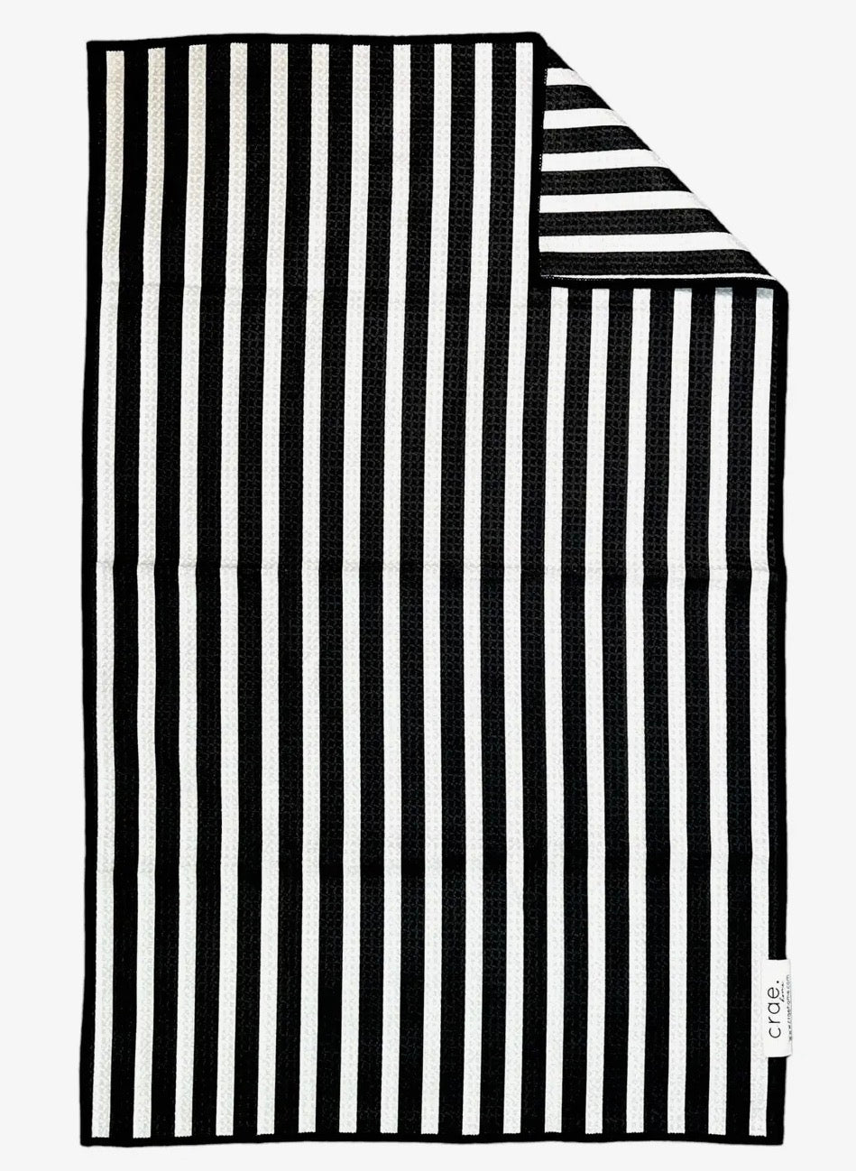 Set of two 17x27-inch hand towels by crae.home in soft, absorbent fabric with a simple, modern design for bathroom use.