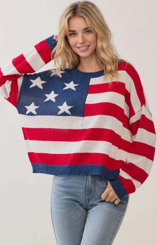 TCEC Stars & Stripes knitted sweater featuring red, white, and blue star patterns on a cozy, warm fabric.
