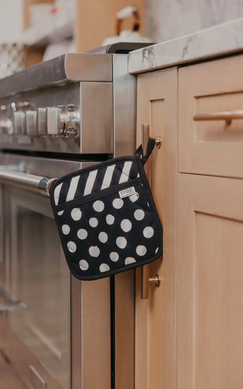 Crae.home pot pads set with round cork and silicone surfaces, designed for protecting countertops from hot cookware.