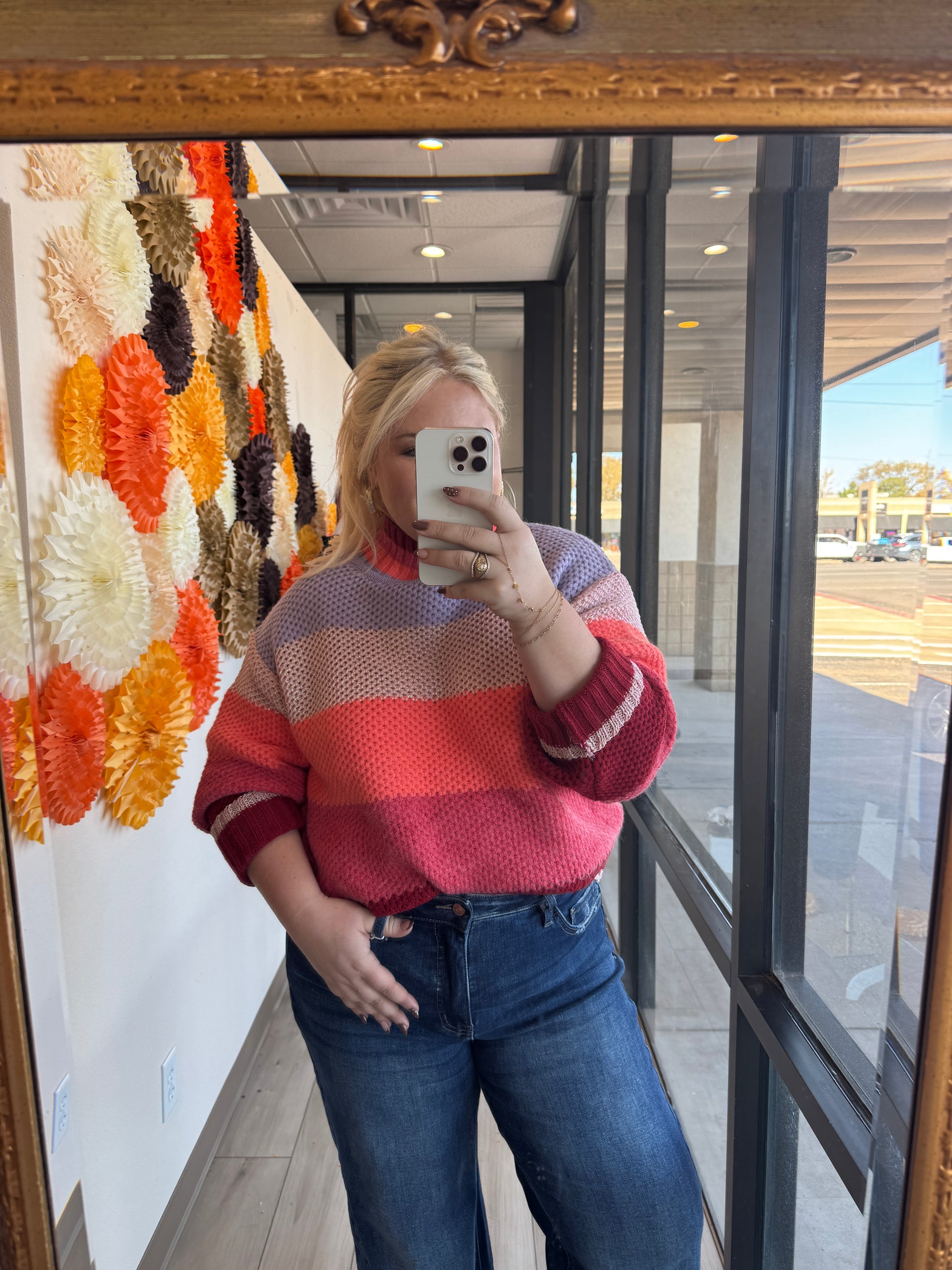 FATE Bold Strokes Turtleneck in a vibrant, artistic design, close-up of the colorful patterned fabric and high neckline.