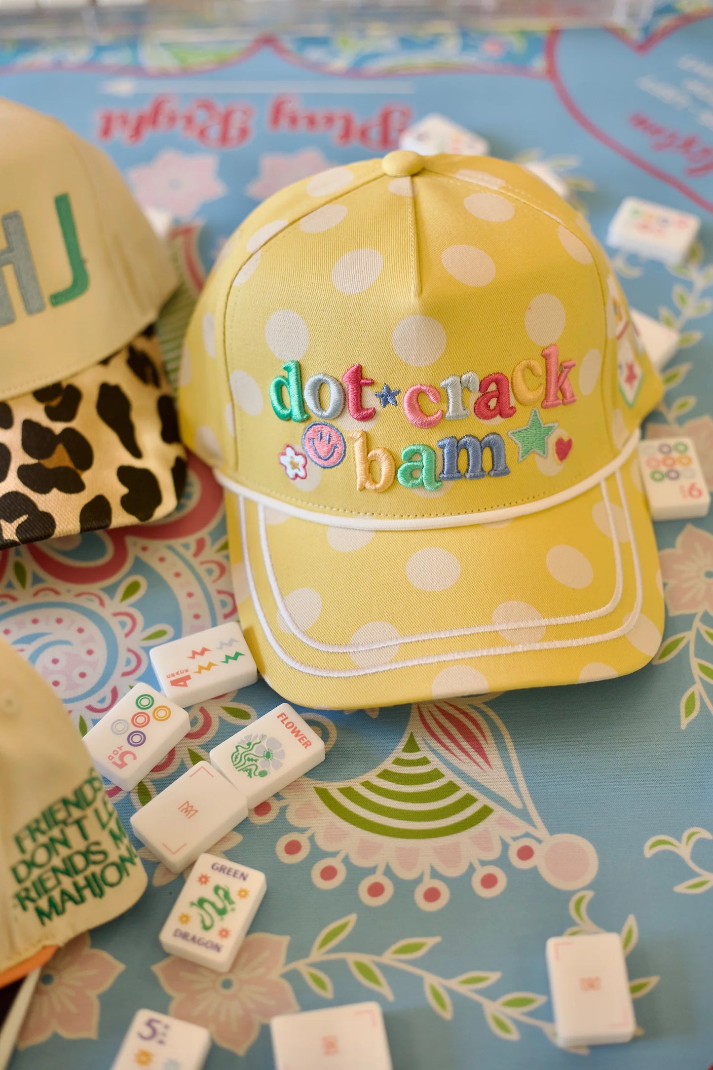 Poppy & Pine Dot. Crack. Bam. Mahjong hat featuring colorful fabric with playful dotted and geometric patterns.