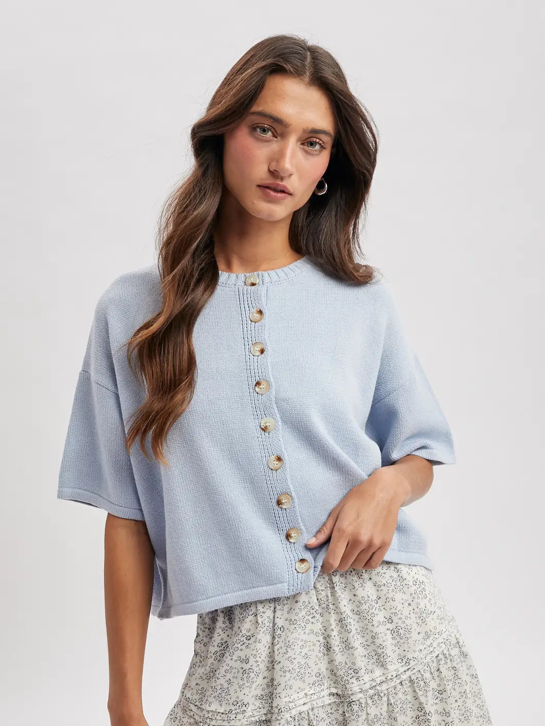 Wishlist Apparel Coastal Climate Top displayed on a hanger, featuring a lightweight, breezy fabric in a neutral tone.
