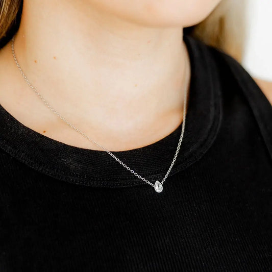 Silver Paloma Pear Drop Necklace by Linny CO featuring a delicate pear-shaped pendant on a sleek chain.
