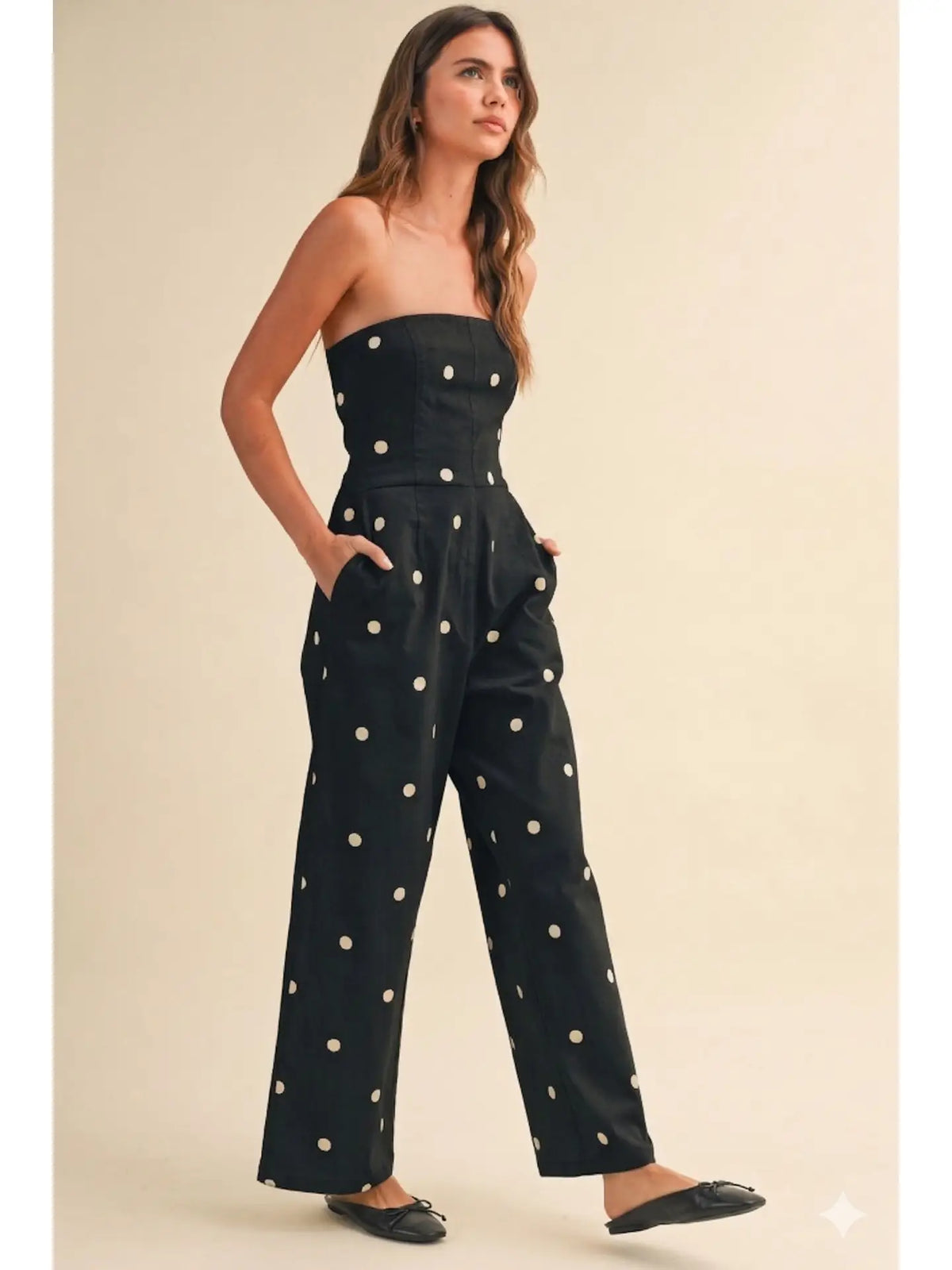 Klesis After Hours jumpsuit in black fabric, featuring wide legs and a stylish, fitted silhouette for a chic evening look.