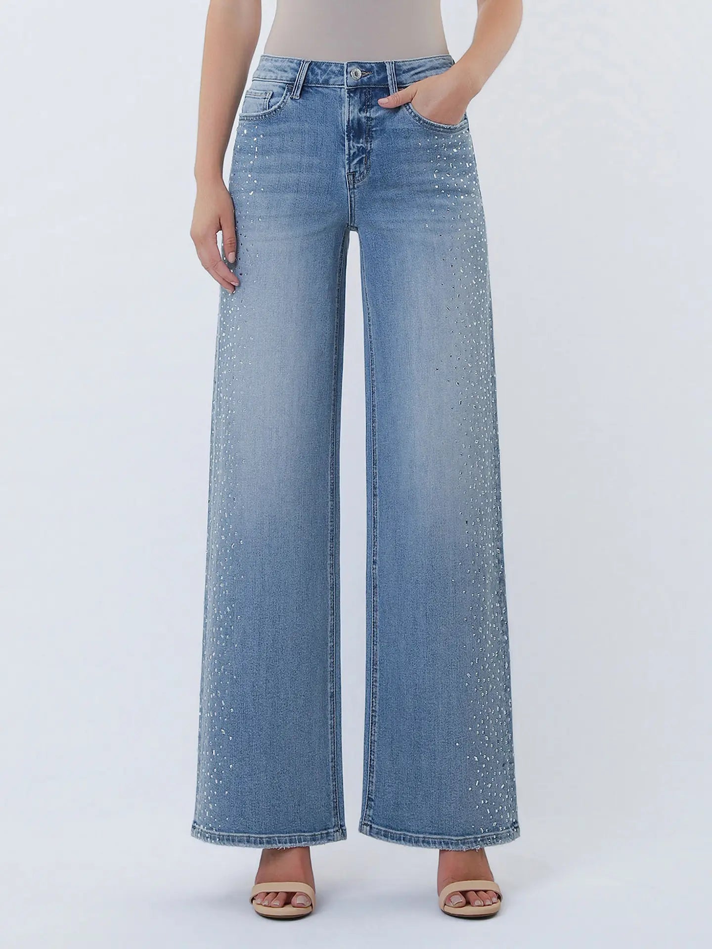 Vervet Glam wide leg jeans with high waist and distressed details, shown on a model in a casual pose.
