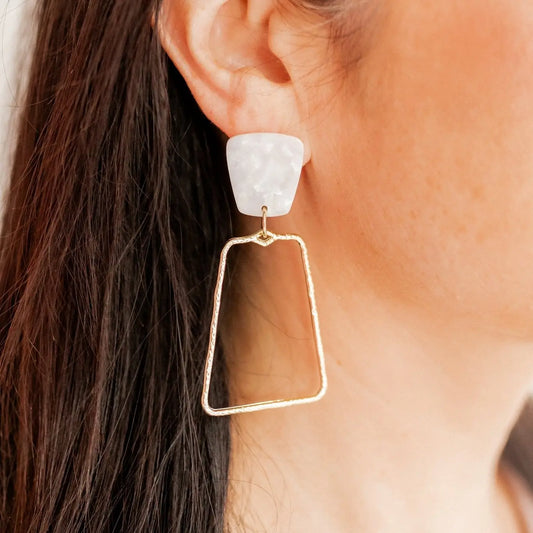 Elegant Kaelyn Pearl Earrings by Linny Co featuring lustrous pearls and a delicate gold setting for a sophisticated look.