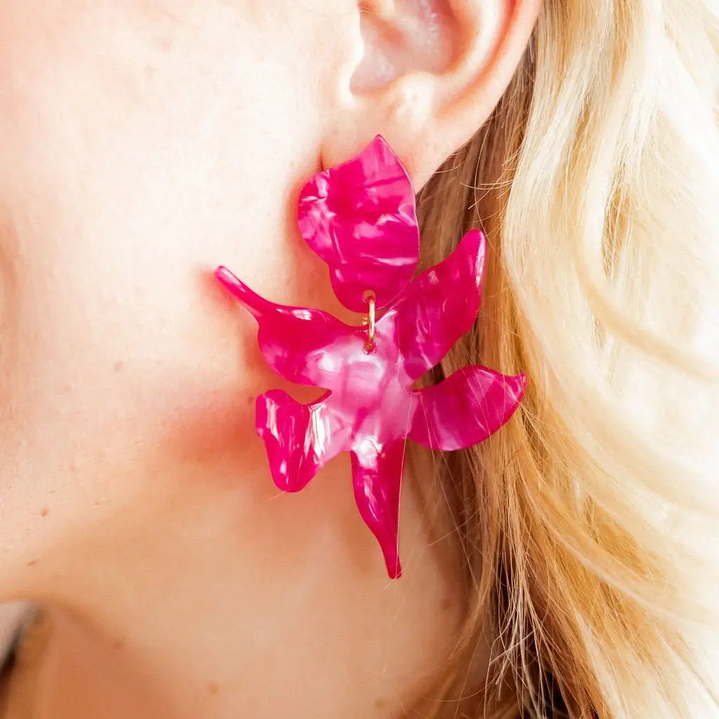 Pearlized pink Flora statement earrings by Linny Co featuring bold, floral-inspired design and shiny pink accents.
