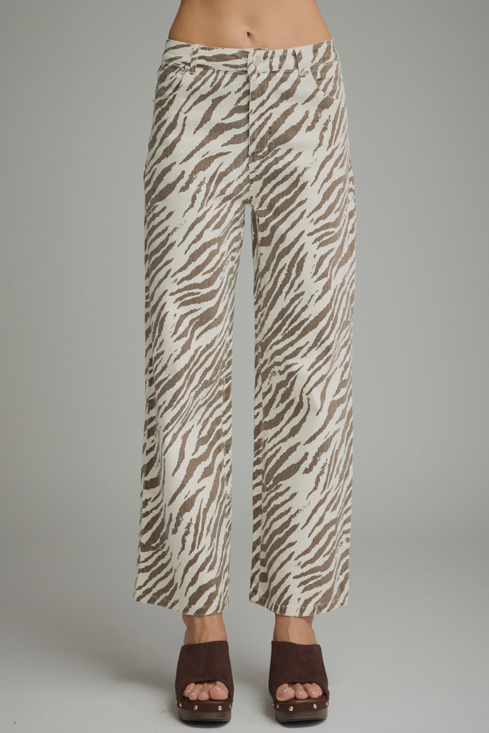 Entro Untamed Beauty jeans featuring classic fit, denim fabric, and stylish design, shown hanging on a display.