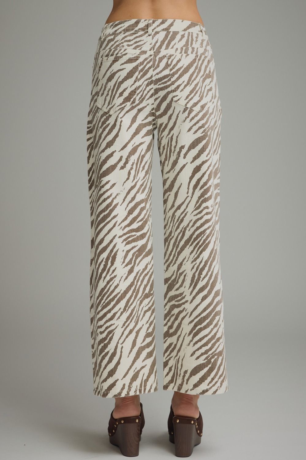 Entro Untamed Beauty jeans displayed on a hanger, showcasing their stylish fit and classic denim design.