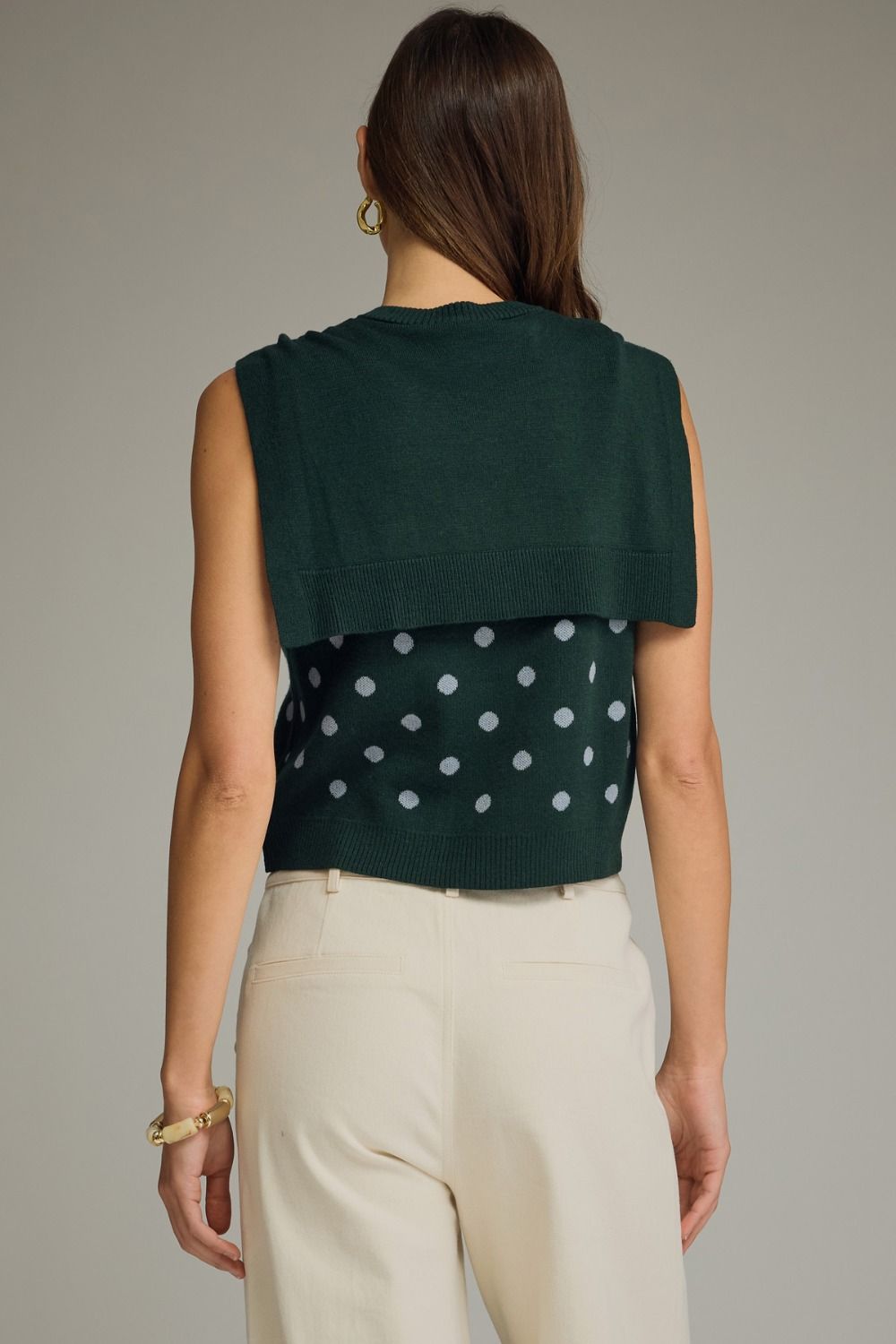 Emerald Sky polka dot tank top by Entro featuring a sleeveless design and a relaxed fit, perfect for casual wear.