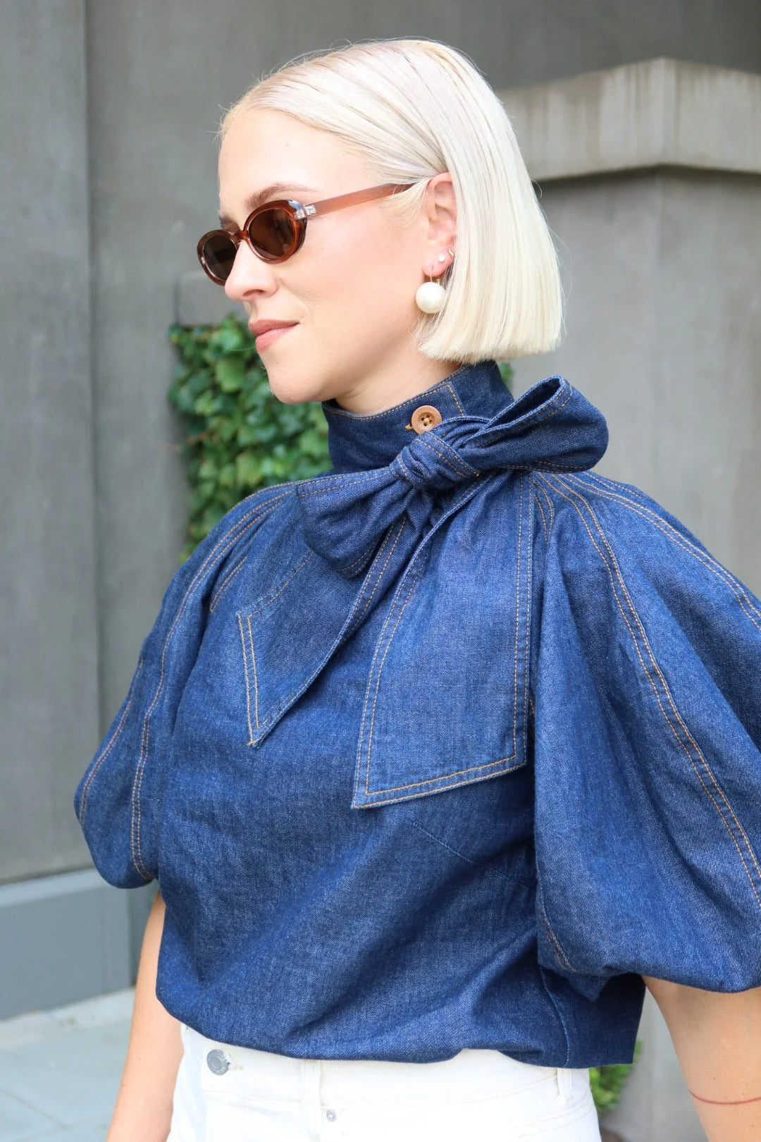 Mary Pearl statement earrings by Linny Co., featuring large pearl accents and elegant gold-tone design for a bold, stylish look.